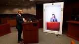 Image shows a lawyer and a hologram witness during a mock trial employing the new technology.