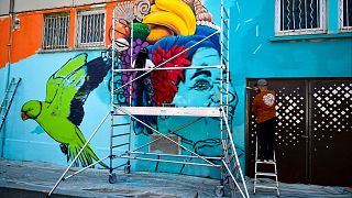 Graffiti street of parakeet and woman