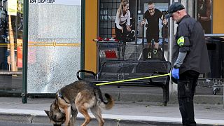 Police at the scene after a shooting incident, in Farsta, southern Stockholm, Saturday, June 10, 2023.
