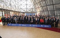Participants pose for a group photo during the meeting 'Supporting the future of Syria and the region' at the European Council building in Brussels, Thursday, June 15, 2023.