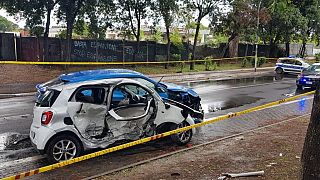 A photo taken on June 14, 2023 and obtained from Italian news agency Ansa shows the site of a car crash that involved a Lamborghini and a Smart in Rome.