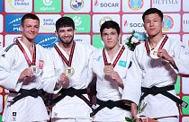 Победитель Махмадбек Махмадбеков (второй слева) и призеры турнира в Астане, весовая категория до 73 кг.