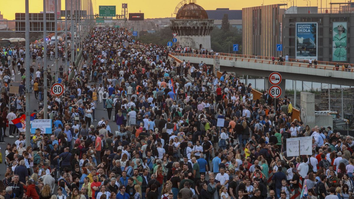 People march on a highway during a protest, in Belgrade, Serbia, Saturday, June 17, 2023.