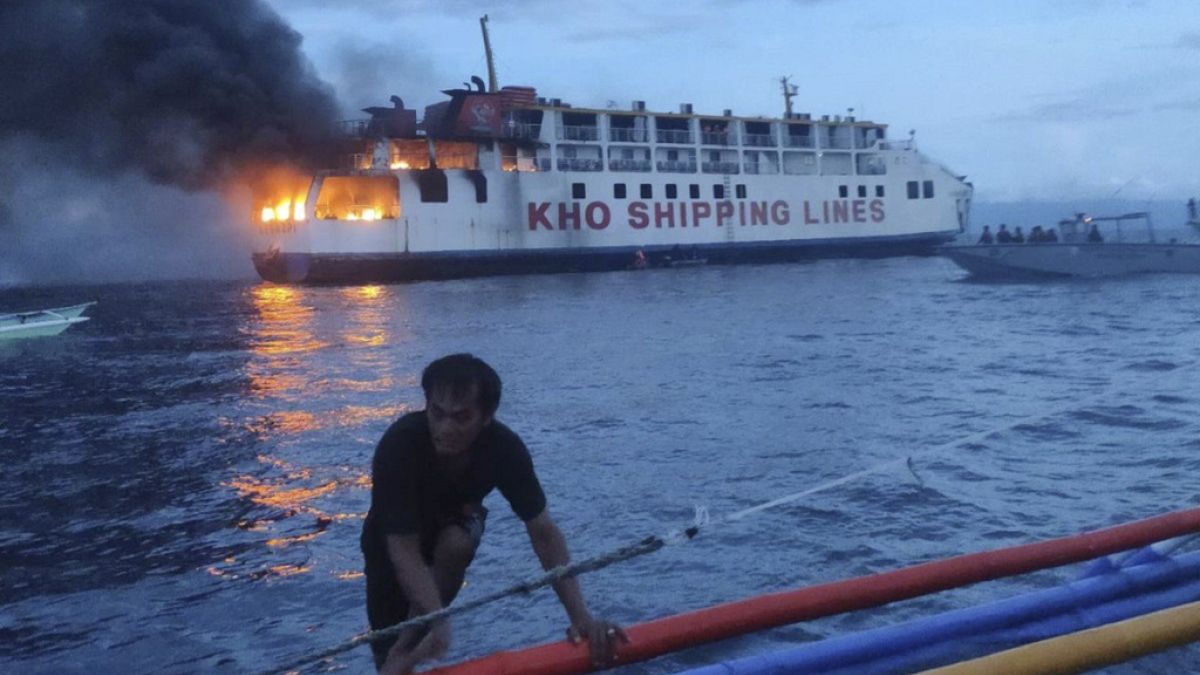 In this handout photo provided by the Philippine Coast Guard, the M/V Esperanza Star as it caught fire at the waters off Panglao, Philippines, on Sunday 18 June, 2023