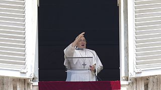 Pope Francis delivers his blessing as he recites the Angelus noon prayer from the window of his studio overlooking St.Peter's Square, at the Vatican, Sunday, June 18, 2023.