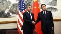 US Secretary of State Antony Blinken, left, shakes hands with Chinese Foreign Minister Qin Gang.