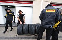 Pirelli technicians check tires during a testing session of Pirelli Formula One.