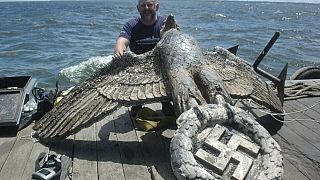 In this Feb. 10, 2006 file photo, workers salvage the eagle from the World War II German pocket battleship Admiral Graf Spee, in Montevideo, Uruguay.