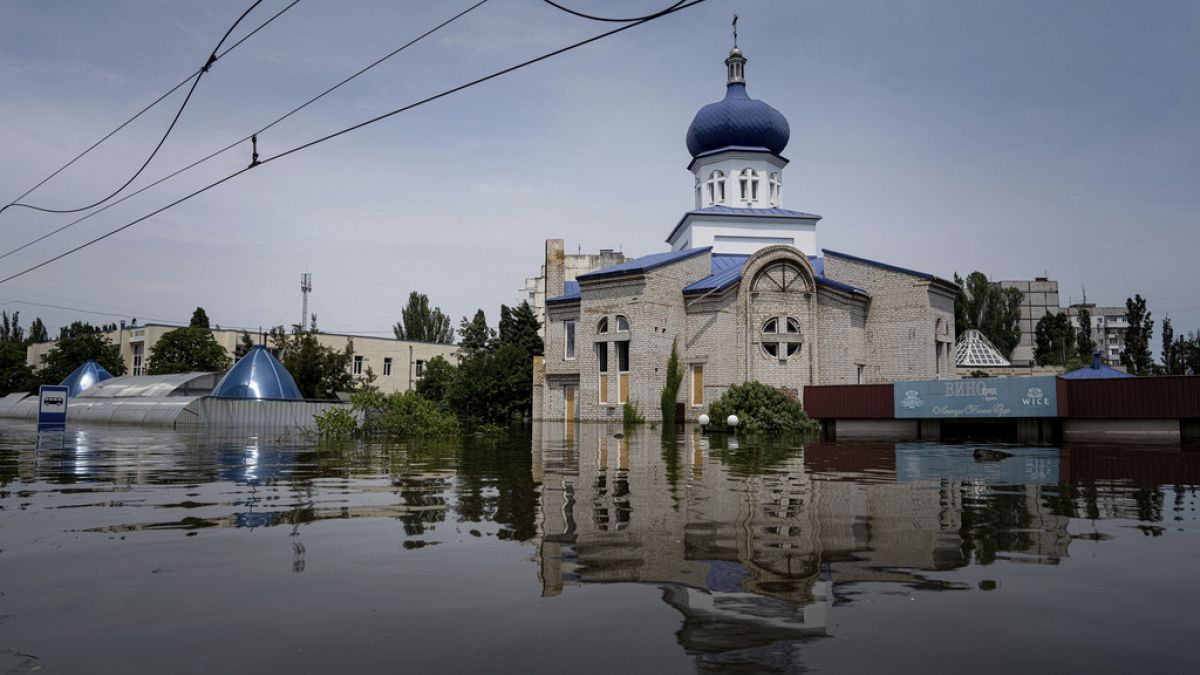 A church is surrounded by water in a flooded neighborhood in Kherson, Ukraine, Thursday, June 8, 2023. 