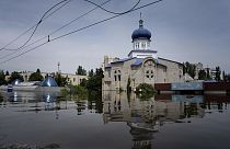 A church is surrounded by water in a flooded neighborhood in Kherson, Ukraine, Thursday, June 8, 2023.