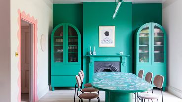 A riot of colour and contrasts - the dining room at Jordan Cluroe and Russell Whitehead's London home 