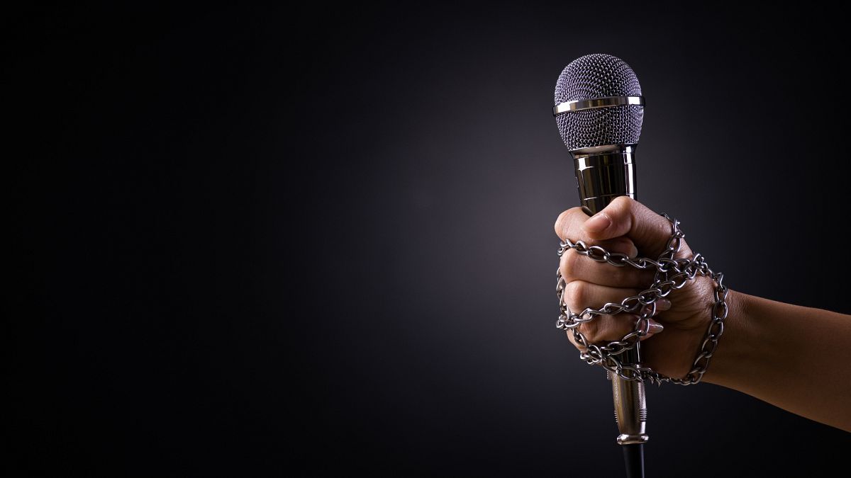 A microphone in chains. 