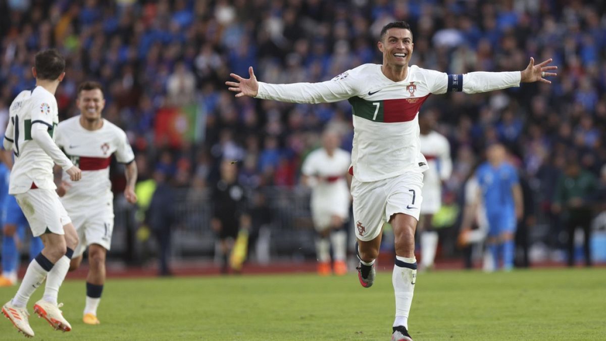 Portugal's Cristiano Ronaldo celebrates after scoring his side's first goal during the Euro 2024 group J qualifying soccer match between Iceland and Portugal in Reykjavík.