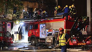 Des pompiers travaillent sur le site de l'explosion dans un restaurant à Yinchua (21 juin 2023)