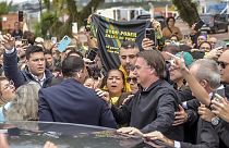 Brazil's former President Jair Bolsonaro is greeted by supporters after landing at the airport in Porto Alegre, Brazil, Thursday, June 22, 2023