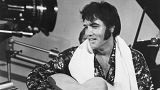 Elvis in happier times - seen here playing guitar in a scene from the documentary film Elvis: That's the Way It Is
