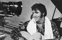 Elvis in happier times - seen here playing guitar in a scene from the documentary film Elvis: That's the Way It Is