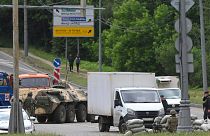 Russian army servicemen, and police officers guard the highway at the entrance to Moscow, Russia, Saturday, June 24, 2023.