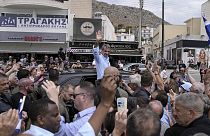 Kyriakos Mitsotakis, leader of Greece's conservative New Democracy party, waves to supporters on the island of Salamina, near Athens, Greece, on Tuesday, June 13, 2023.