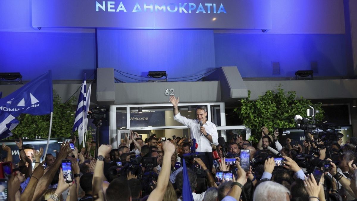 Kyriakos Mitsotakis leader of the center-right New Democracy waves to supporters outside the headquarters of the party in Athens, Greece, Sunday, June 25, 2023. 23..