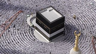 Muslim pilgrims pray around the Kaaba, the cubic building at thGrand Mosque, during the annual Hajj pilgrimage in Mecca, Saudi Arabia, Sunday, June 25, 2023.