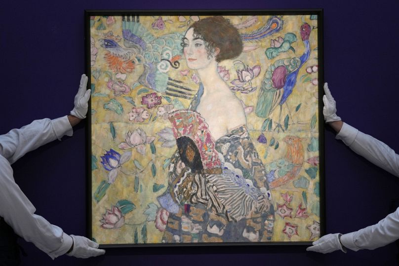 Gustav Klimt's 'Dame mit Faecher' (Lady with a Fan) is displayed at Sotheby's auction rooms in London.