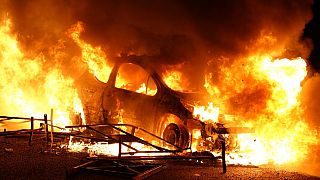 A vehicle burns, destroyed by protesters in Nanterre, west of Paris, on June 27, 2023.
