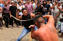 Catholic men participate in the dance called "Chinegro", which consists of hitting each other with swords made of stretched and dried bull penises. 