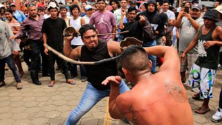 Catholic men participate in the dance called "Chinegro", which consists of hitting each other with swords made of stretched and dried bull penises.