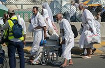 Pilgrims walk at Mina tent camp during the annual Hajj pilgrimage, near the holy city of Mecca, Saudi Arabia, Wednesday, June 28, 2023.