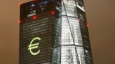 The Euro logo is projected onto the headquarters of the European Central Bank during a dress rehearsal for the "Luminale" light show in Frankfurt, Germany.