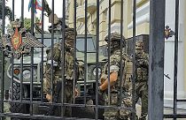 Servicemen of the Wagner Group military company guard an area at the headquarters of the Southern Military District in Rostov-on-Don, Russia, Saturday, June 24, 2023.