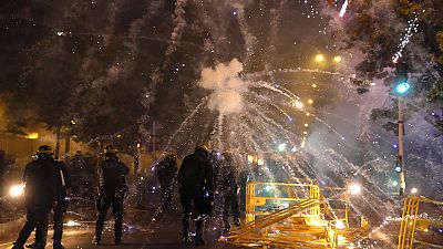Clashes in Paris' suburbs rumbled on as fireworks were directed at French police in Paris after the shooting of a 17-year old boy