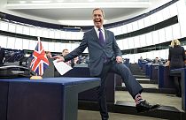 Former UK Independence Party (UKIP) leader and member of the European Parliament Nigel Farage shows his socks at the European Parliament in Strasbourg, France, 2019.