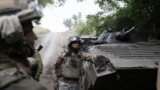 Ukrainian servicemen with their APC near Bakhmut, Donetsk