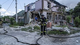 Ukrainian State Emergency Service firefighters put out a fire at a house destroyed in a Russian shelling, in a residential neighbourhood, in Kherson, Ukraine, Saturday, July 1