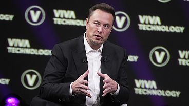 Elon Musk, who owns Twitter, Tesla and SpaceX, speaks at the VivaTech fair, June 16, 2023, in Paris. 