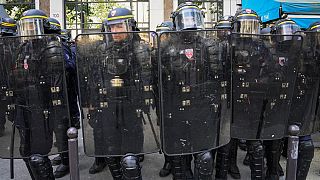 Riot police officers take position during a protest in Paris, France, Tuesday, June 6, 2023.