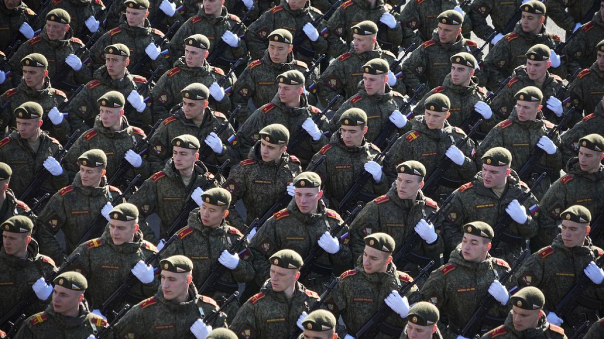 Russian soldiers march toward Red Square to attend a dress rehearsal for the Victory Day military parade in Moscow, Russia, Sunday, May 7, 2023. 