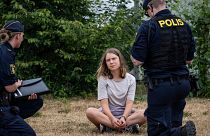 Police officers talk to the Swedish climate activist Greta Thunberg in Malmo, Sweden, 19 June 2023.