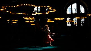 A child walks under a spot light at the Byzantine-era Hagia Sophia mosque in Istanbul.