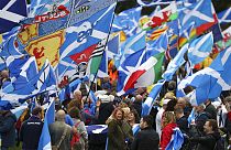 Scottish independence supporters march through Edinburgh, Scotland, Saturday Oct. 5, 2019.