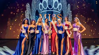 Rikkie Valerie Kollé poses with her co-competitors after being crowned Miss Netherlands