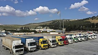 Trucks loaded with UN humanitarian aid for Syria following an earthquake are parked at Bab al-Hawa border crossing with Turkey, in Syria's Idlib province, Feb 10 2023
