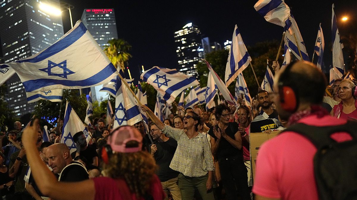 Israelis protest plans by Prime Minister Benjamin Netanyahu's government to overhaul the judicial system, in Tel Aviv, Israel, Tuesday, July 11, 2023