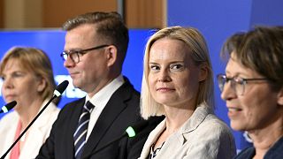 FILE: Far-right Finns Party leader Riikka Purra looks at camera, with other party leaders in government, 15 June 2023