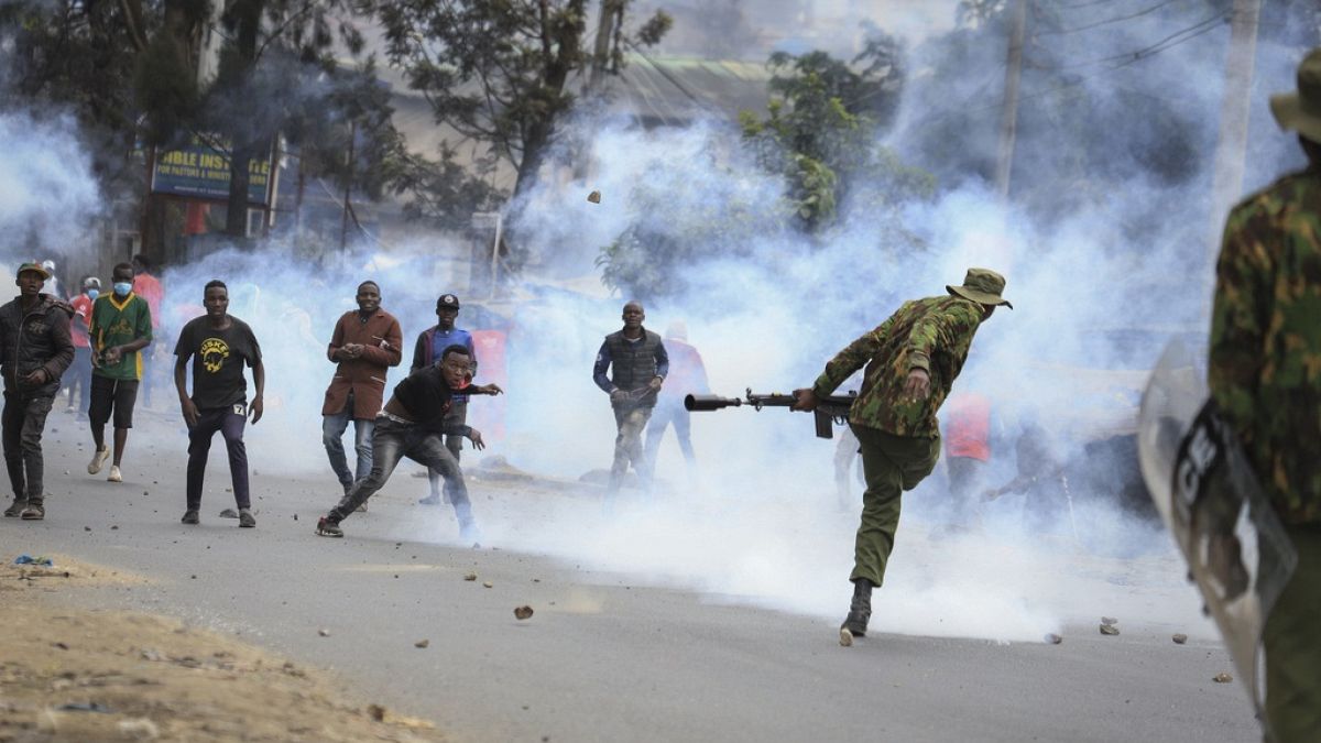 Protesters throwing rocks and police firing tear gas clash in the Mathare neighborhood of Nairobi, Kenya Wednesday, July 12, 2023. 