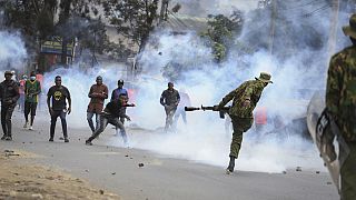 Protesters throwing rocks and police firing tear gas clash in the Mathare neighborhood of Nairobi, Kenya Wednesday, July 12, 2023. 