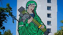 A mural depicts an image known as "Saint Javelina"- Virgin Mary cradling a US-made FGM-148 anti-tank weapon Javelin in Ukraine. 