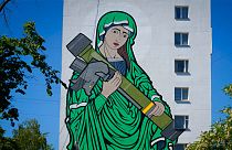 A mural depicts an image known as "Saint Javelina"- Virgin Mary cradling a US-made FGM-148 anti-tank weapon Javelin in Ukraine.